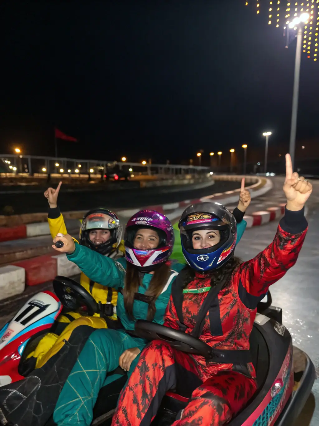 A picture of young drivers celebrating a successful race, capturing the excitement and camaraderie of competitive events.